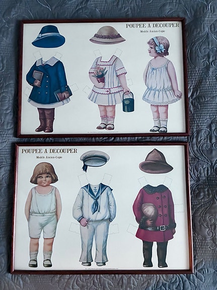 Vanhat paperinuket kehyksissä