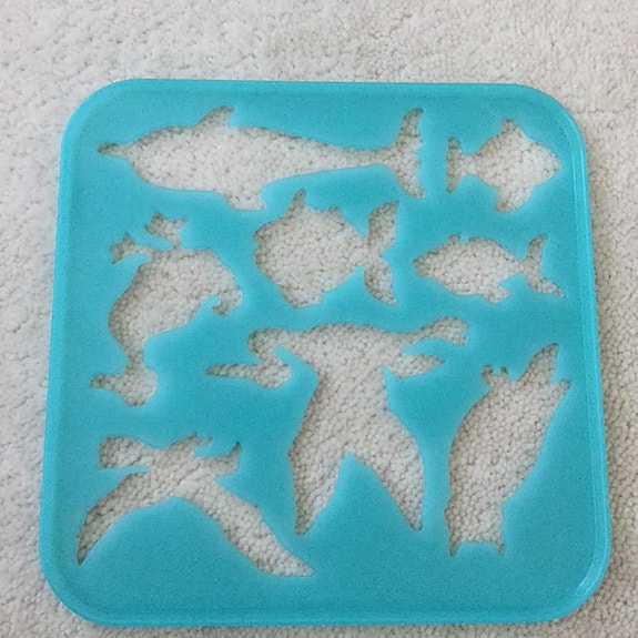 Tupperware piirustuslevy lintuja ja kaloja