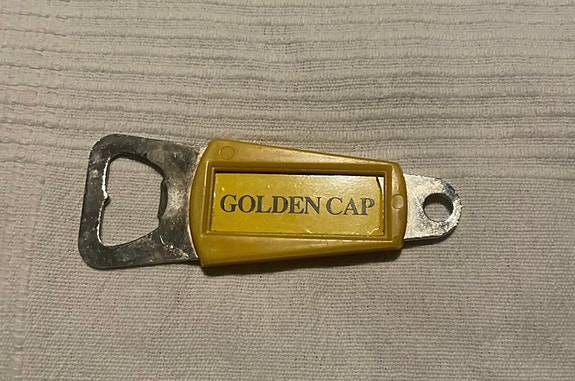 Golden cap pullonavaaja