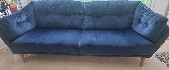 Sininen sametti sohva
