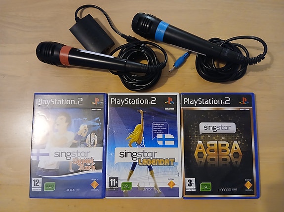SingStar mikrofonit + 2 kpl pelejä (PS2)