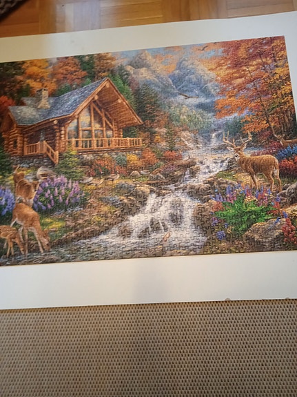 Maisemataulu mökki ja metsäpeurat