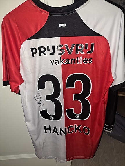 Hanckon pelipaita nimmarilla