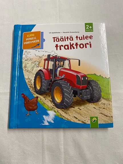 Täältä tulee traktori lastenkirja kovakantinen suomi
