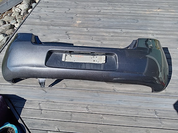 Toyota Yaris 06-11 takapuskuri harmaa