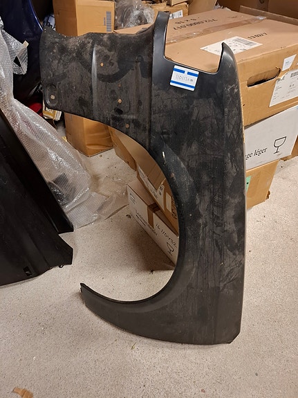 Etulokasuoja vasen Opel Corsa A 1101130
