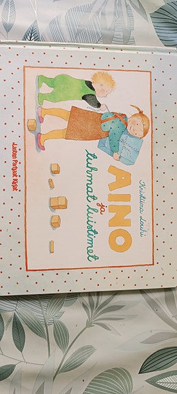 Aino ja tuhmat luistimet Aino kirja