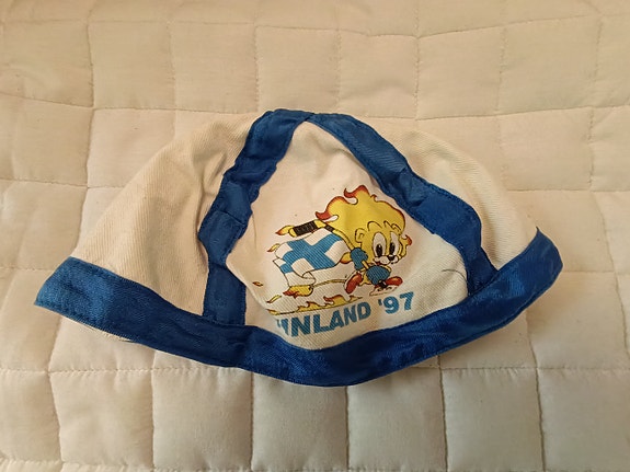 Leijonat-päähine MM-kotikisoista 1997