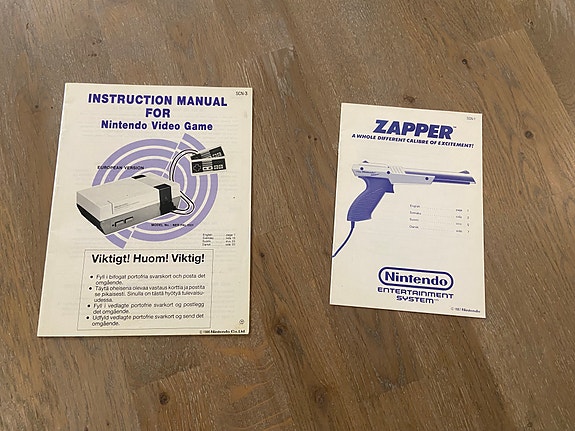 Nintendo SCN NES-käyttöohje ja Zapper-käyttöohje