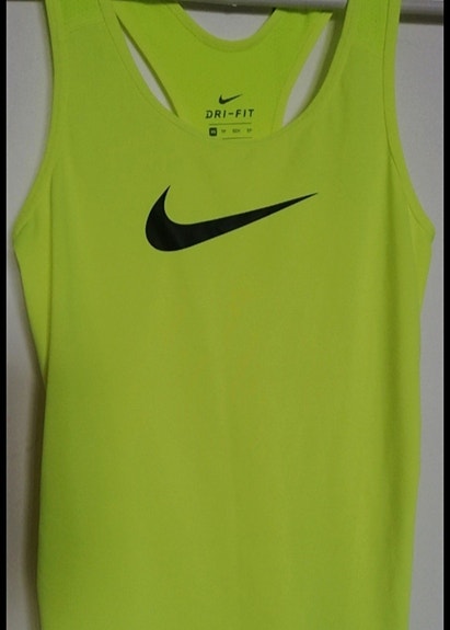 Nike keltainen urheilutoppi