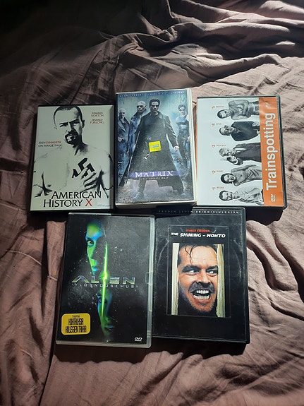 VHS ja DVD elokuvia: Matrix Trainspotting Shining Alien American History X
