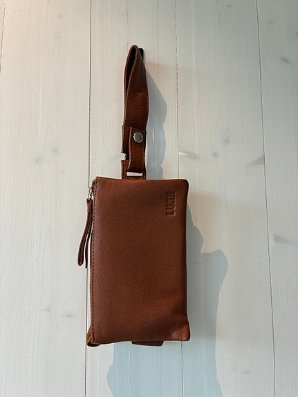 Lumi konjakinvärinen clutch käsilaukku