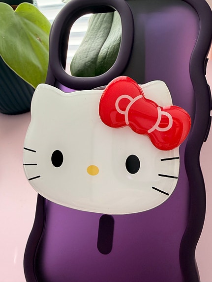 Hello Kitty MagSafe ‑magneettipidike iPhonelle Samankaltainen kuin PopSocket