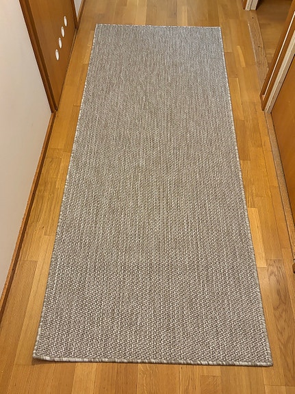 Beige eteisen matto