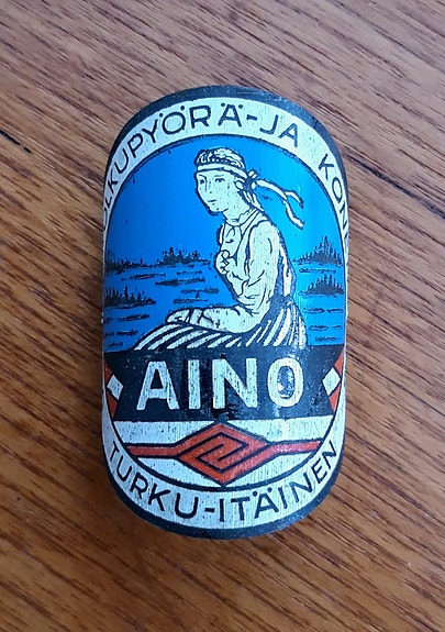 AINO Suomen polkupyörä- ja konetehds Turku itäinen 30-luku pyörän keulamerkki