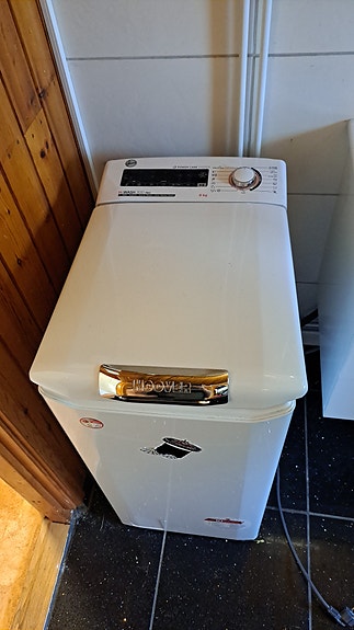 Hoover päältä täytettävä pesukone