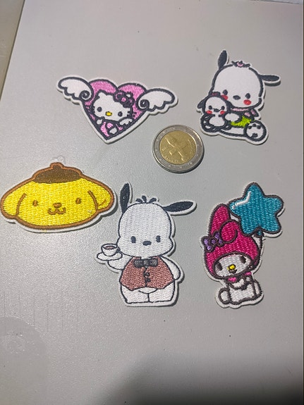Hello Kitty ja muut hahmot kangasmerkit