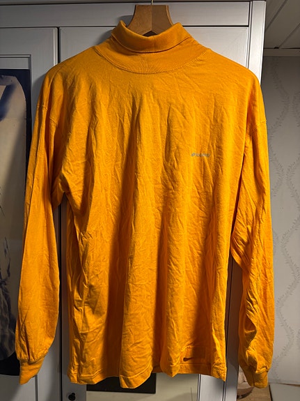 Karhun vintage poolopaita, oranssi, koko L (unisex) hintalappu tallella