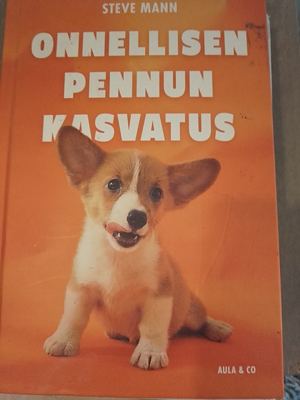 Onnellisen pennun kasvatus - koirankoulutuskirja