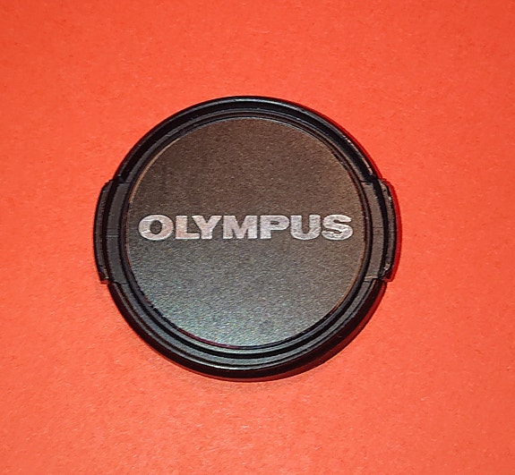 Olympus kameran linssisuoja