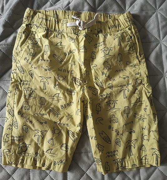 Keltaiset poikien shortsit koko 128