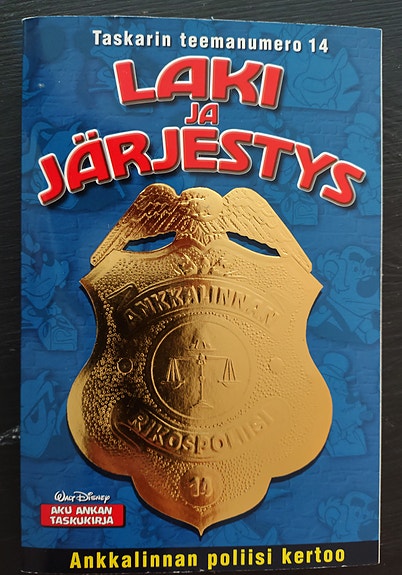 AKU ANKAN TASKUKIRJA - TASKARIN TEEMANUMERO 14 - ANKKALINNAN POLIISI KERTOO