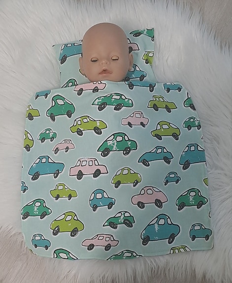 Baby Born (43 cm)nuken peitto ja tyyny autokuosilla