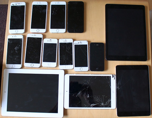 Vanhoja rikkinäisiä iPhoneja ja iPadeja