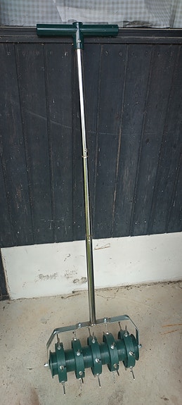 Lawn spike-aerator roller