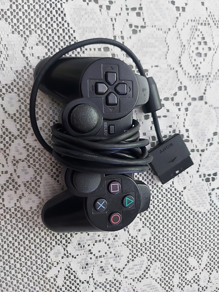 Sony PlayStation ohjain musta johdollinen
