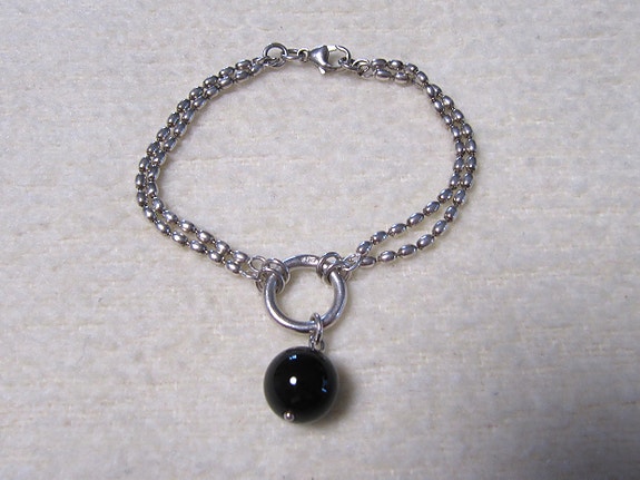 Pore rannekoru, hopea/onyx, Kalevala