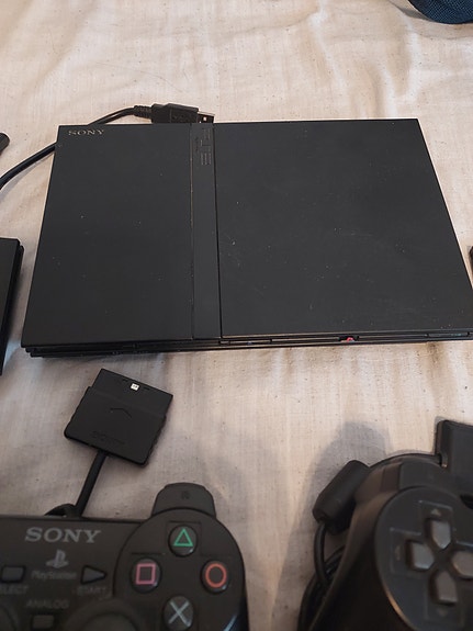 Sony PlayStation 2 Slim konsoli SingStar-tarvikkeilla
