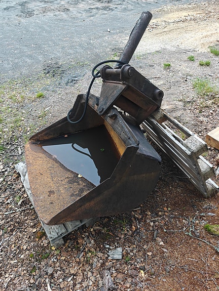 Kaivinkoneen Kallistuva kauha