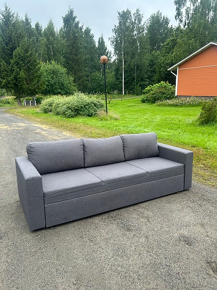 Tummanharmaa vuodesohva sisältäen kuljetuksen