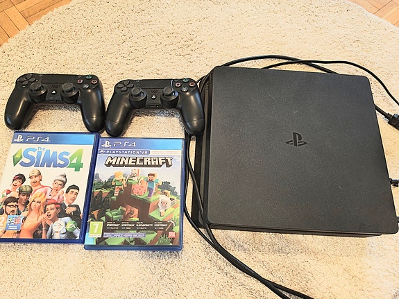 Sony PlayStation 4 pelikonsoli, kaksi ohjainta ja kaksi peliä