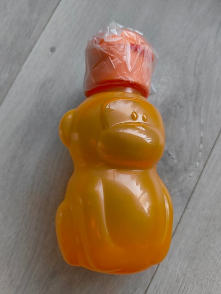 Tupperware oranssi apina juomapullo